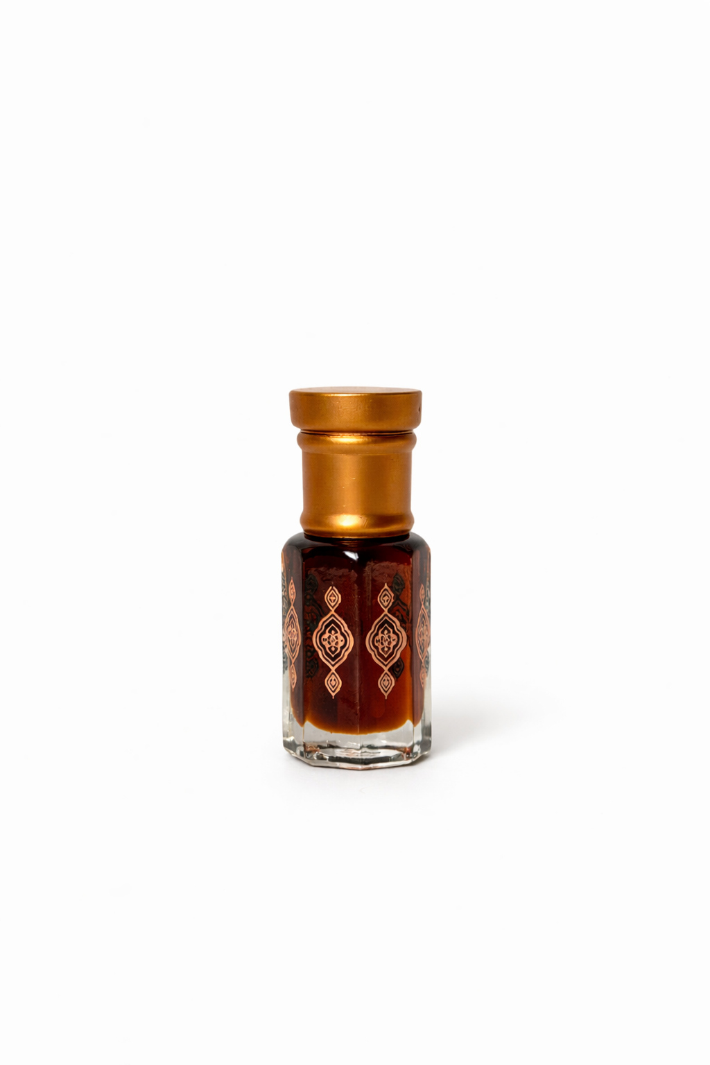 Small glass bottle with gold cap on a white background